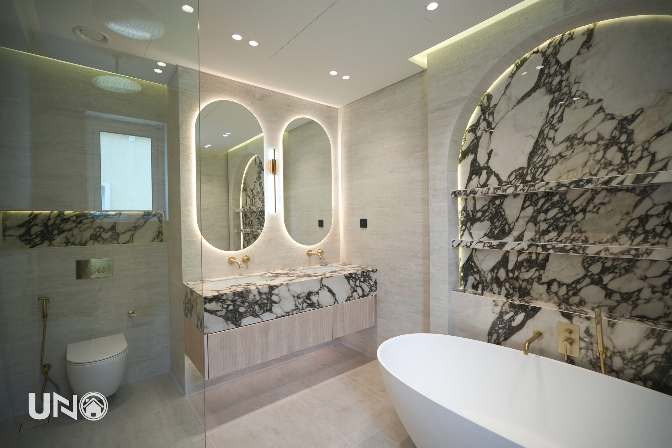 Veined marble vanity with brass fittings