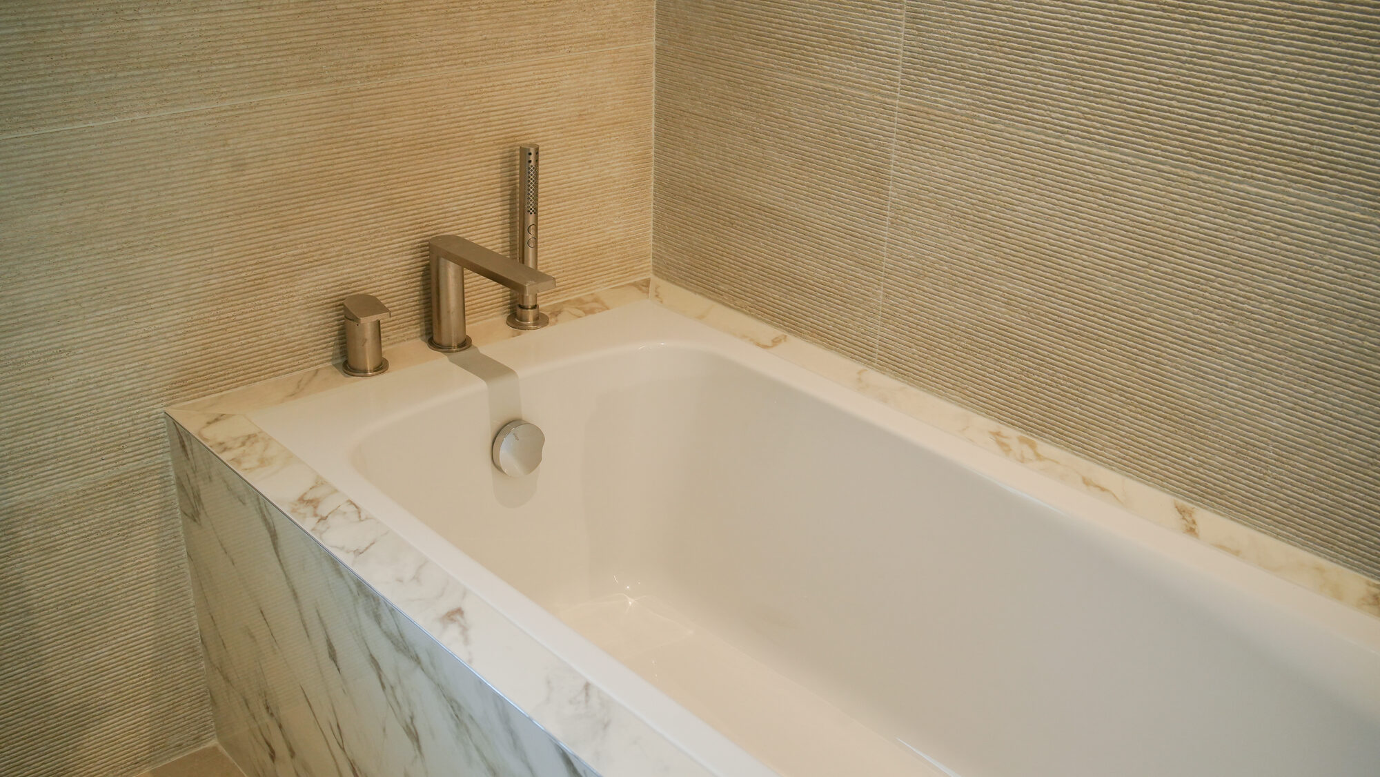 Marble bath being installed during fit out