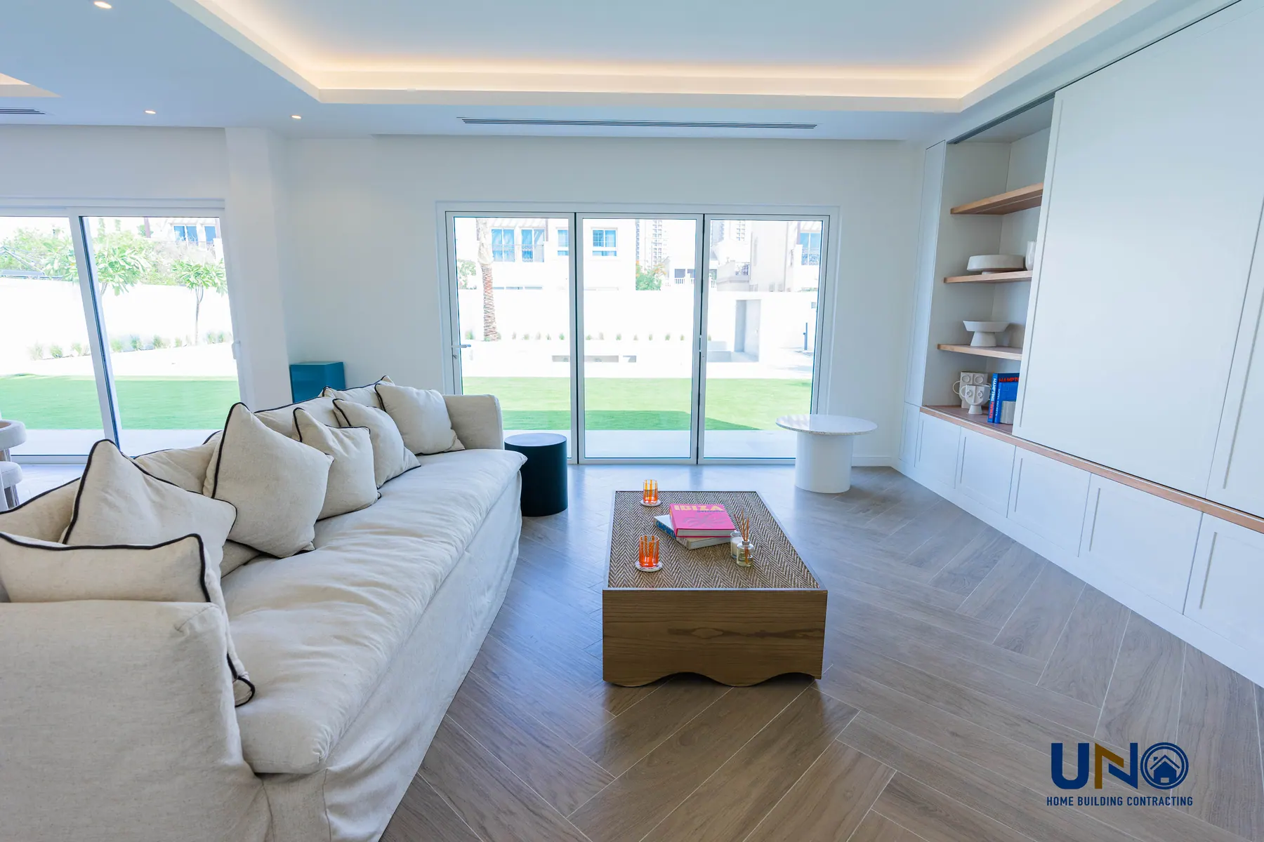 Living room opening to the garden with built-in joinery