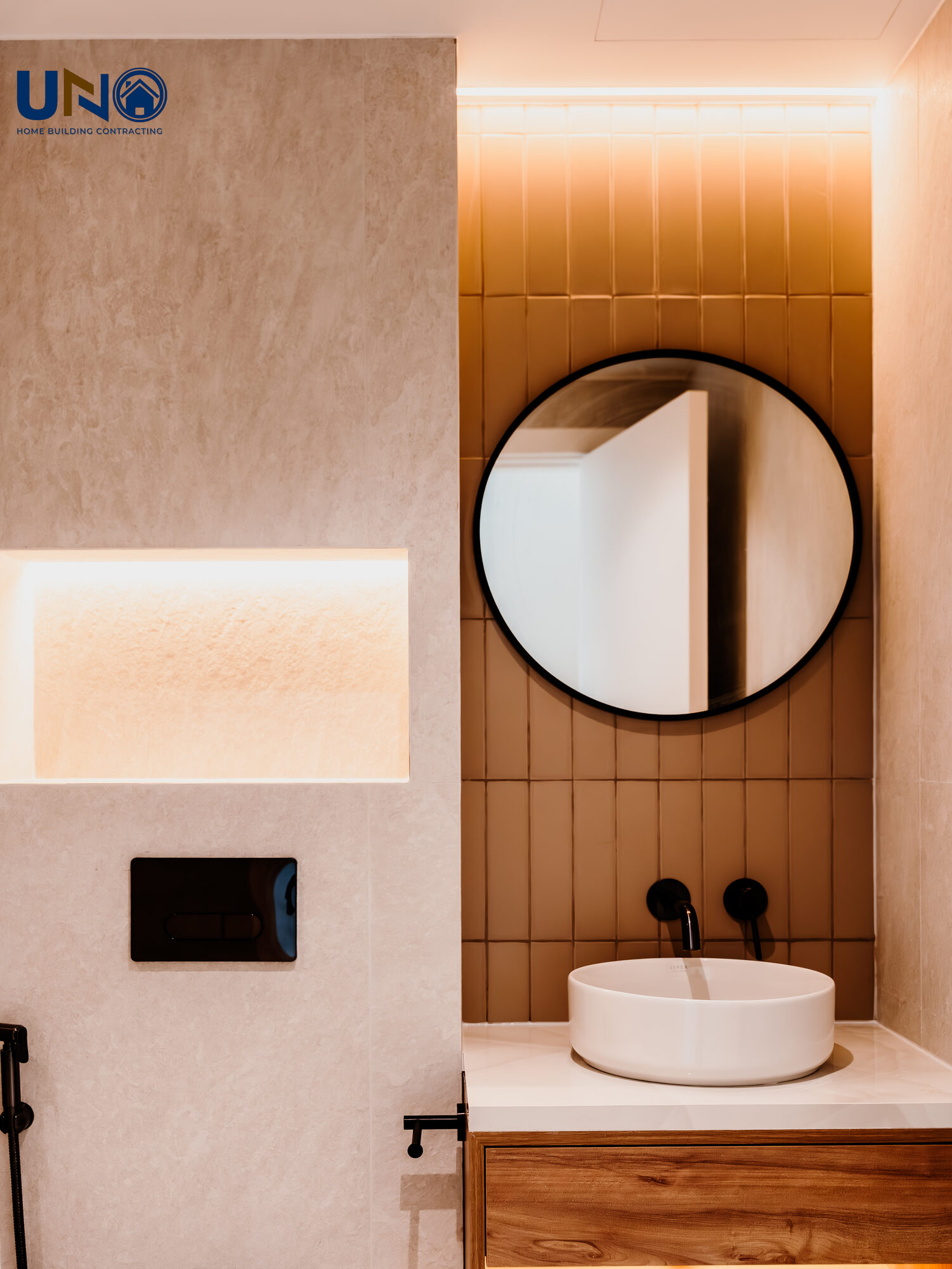 Vanity with a round mirror and warm timber joinery