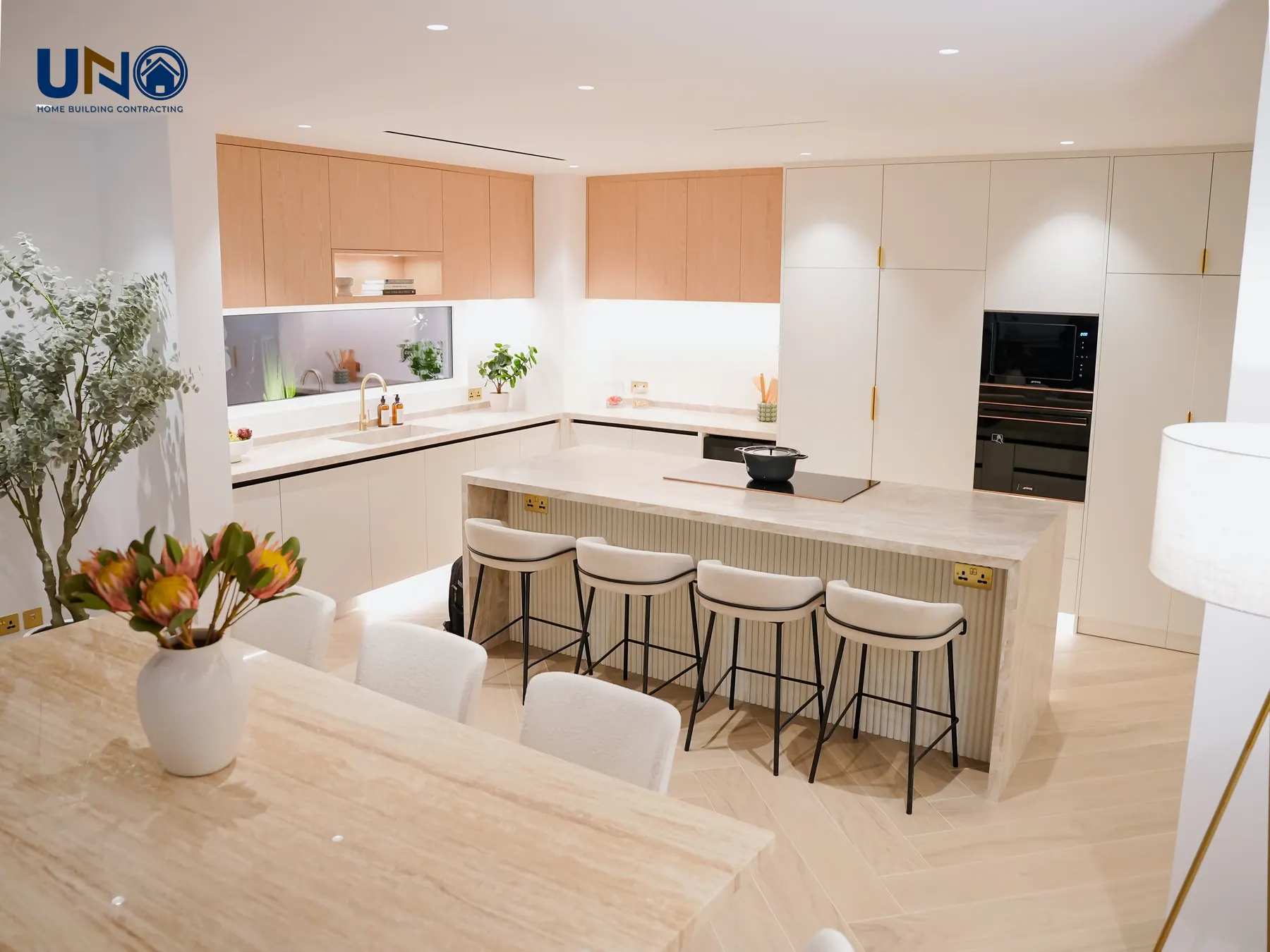Open-plan kitchen with a stone island and bar seating