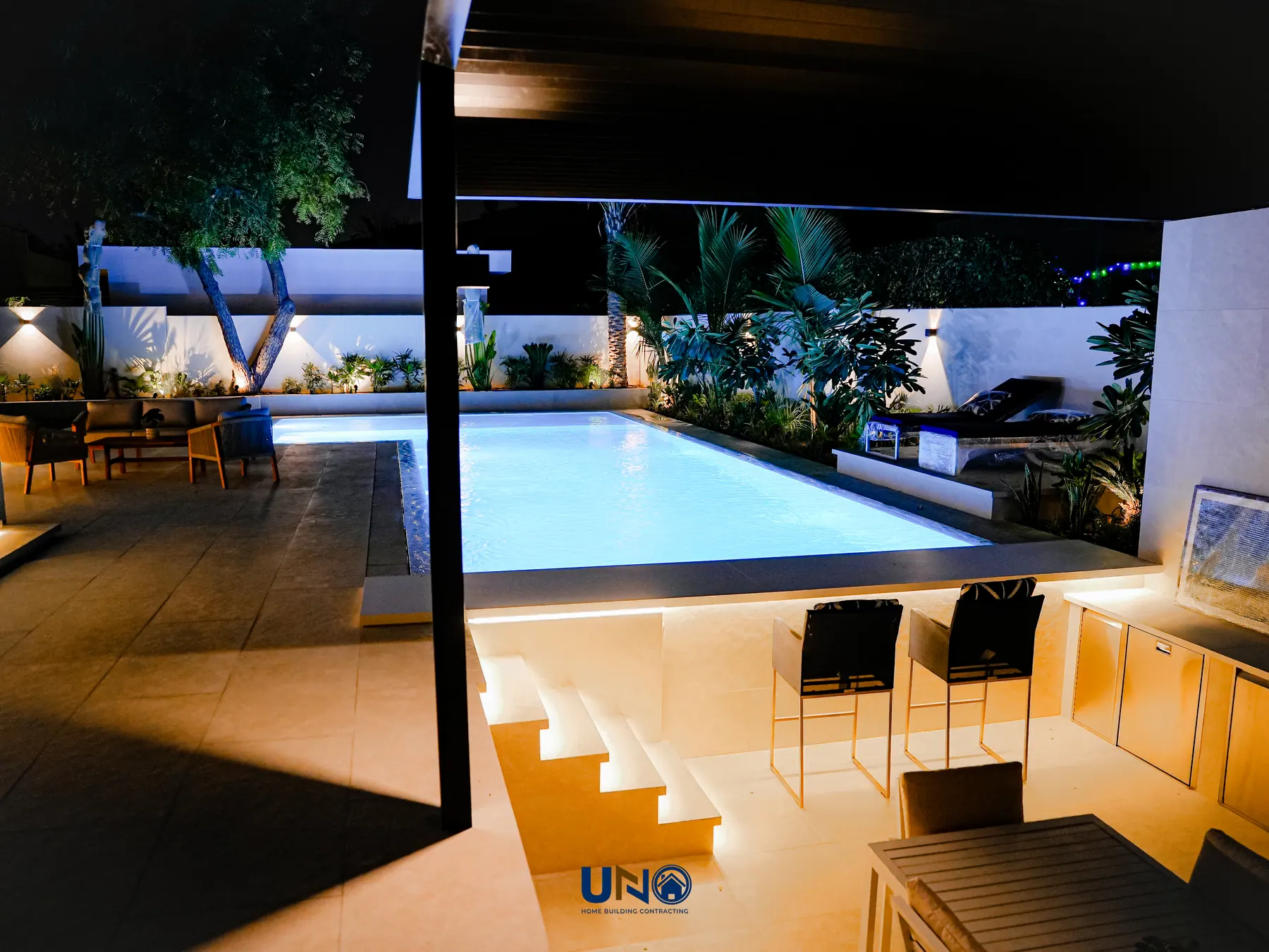 Poolside terrace and outdoor lounge at night