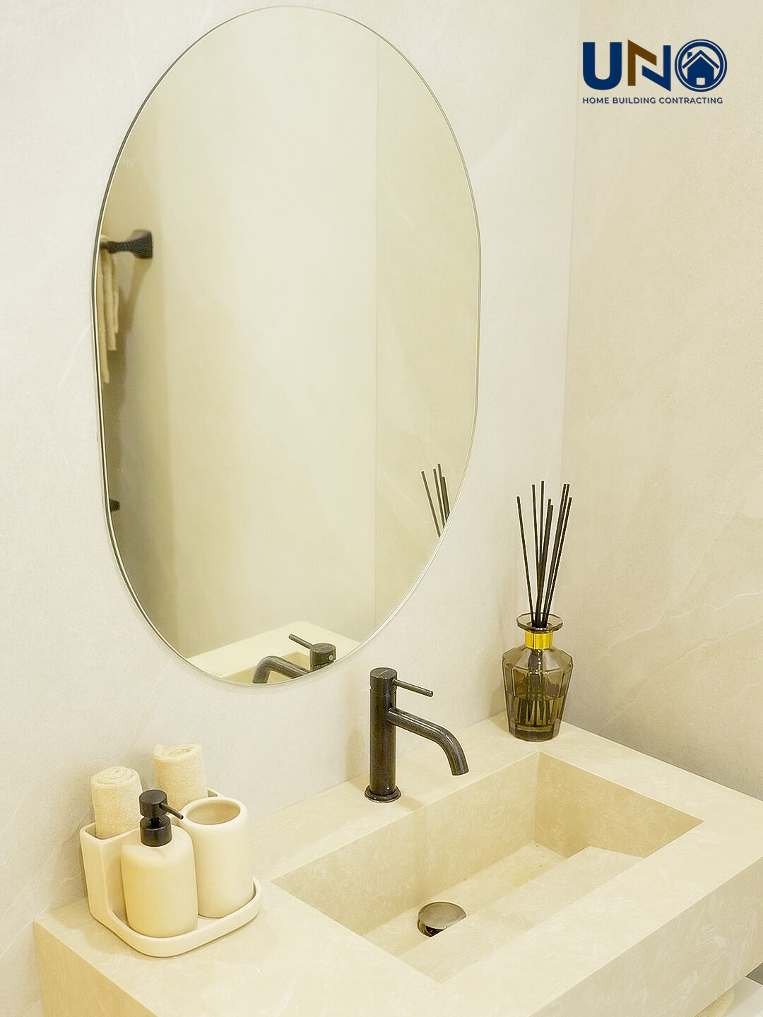 Vanity with a backlit oval mirror