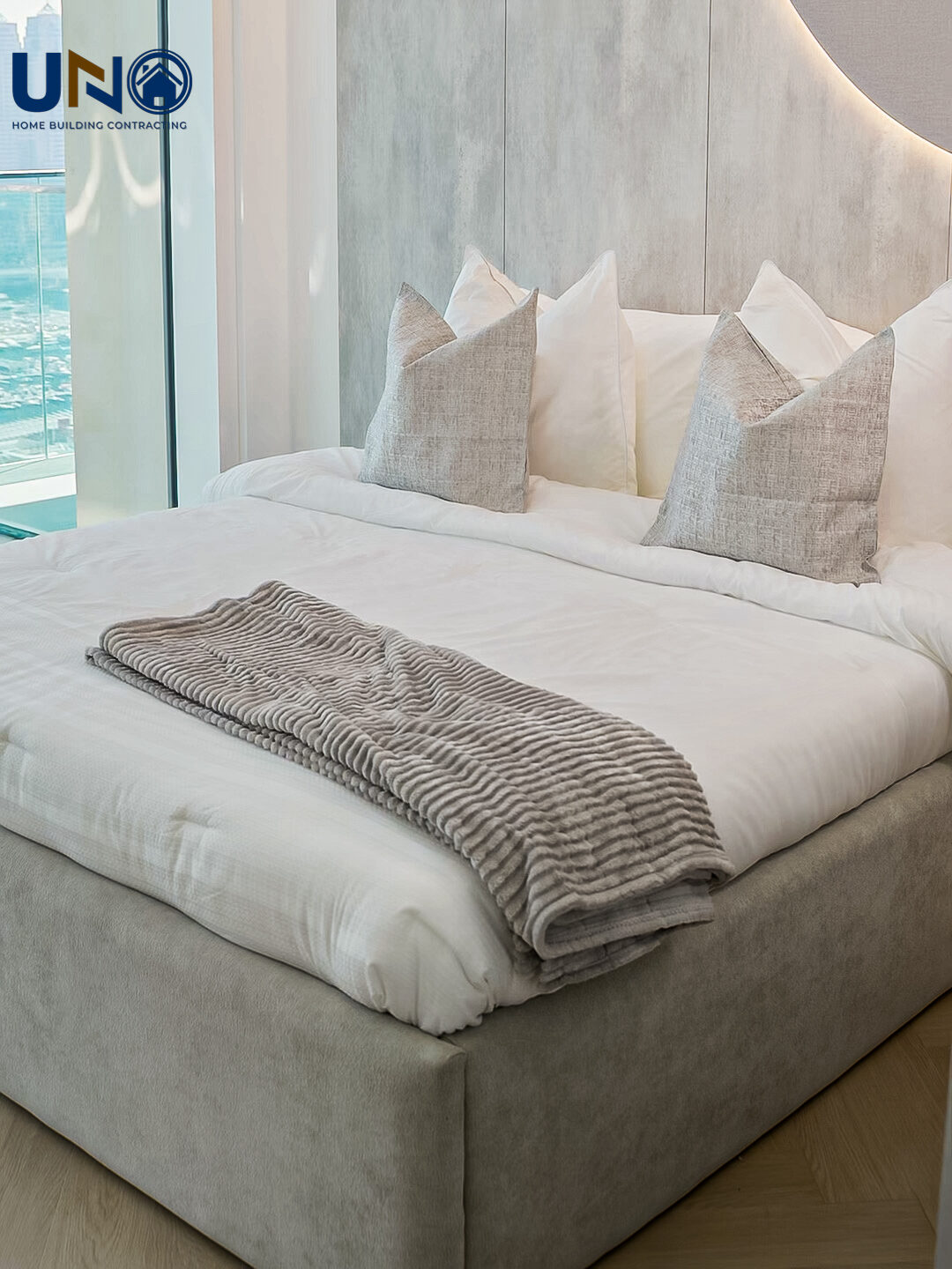 Bedroom with a stone feature wall